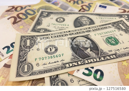 Euro and Dollar Banknotes Close-Up.Euro and US dollar bills together, symbolizing global finance, wealth, and international currency exchange. Euro and Dollar Banknotes Close-Up.Euro and US dollar bills together, symbolizing global finance, wealth, and international currency exchange. 127516580