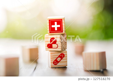Lay out wooden blocks with icons of medical health. health insurance for your health concept. 127518270