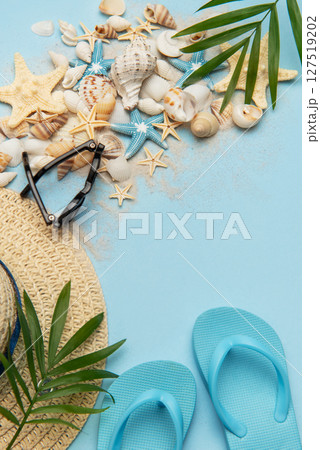 Beach accessories creating a summer holiday background with copy space 127519202