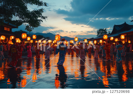 a traditional Obon dance performed at night, participants wearing yukatas dancing in a circle under glowing lanterns 127520698