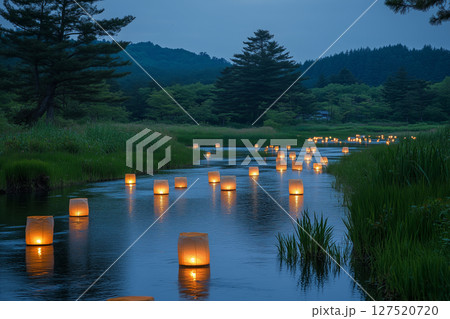 an illuminated river with floating lanterns during Obon, reflecting warm lights on the water, surrounded by a peaceful forested landscape, soft twilight lighting 127520720