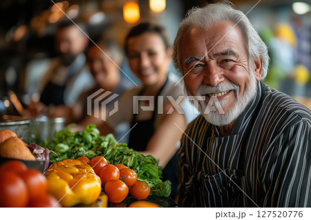 a group of elderly people participating in a cooking class, smiling and engaging as they prepare a meal 127520776