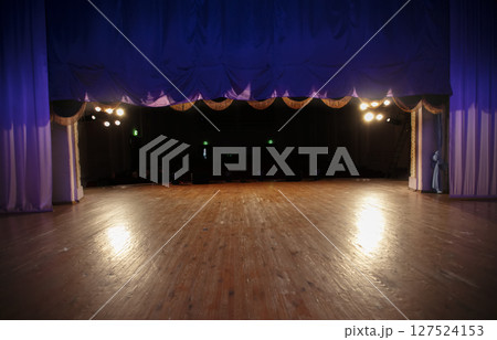 Theatrical stage. The curtain opens in front of the auditorium. Theatrical stage. The curtain opens in front of the auditorium. 127524153