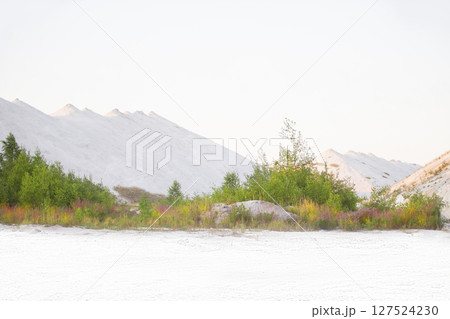 Beautiful landscape of white mountains and sand. Unusual natural landscape. Waste from old chemical production. 127524230