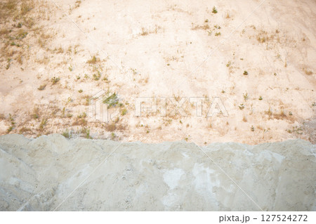 Mountain texture with white sand and vegetation. Waste from old chemical production. Mountain texture with white sand and vegetation. Waste from old chemical production. 127524272