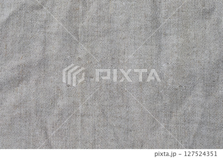 Texture of gray crumpled linen fabric close-up. 127524351