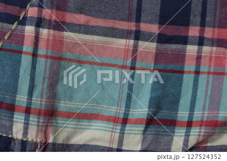 Texture of checkered cotton fabric close-up. Texture of checkered cotton fabric close-up. 127524352