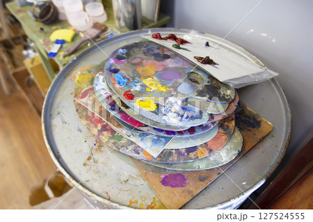 A palette of oil paints. Artist Desktop 127524555