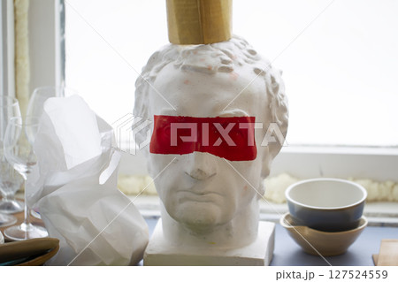 Caesar plaster head with red stripe on the eyes. Caesar plaster head with red stripe on the eyes. 127524559