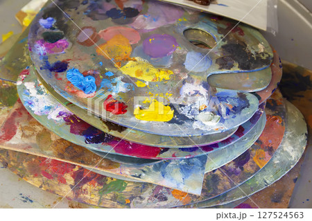 A palette of oil paints. Artist Desktop 127524563