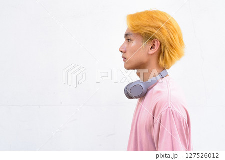 Thai gay teen man with pink shirt and septum ring 127526012