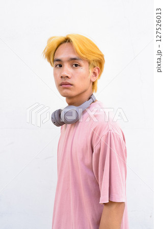 Thai gay teen man with pink shirt and septum ring 127526013