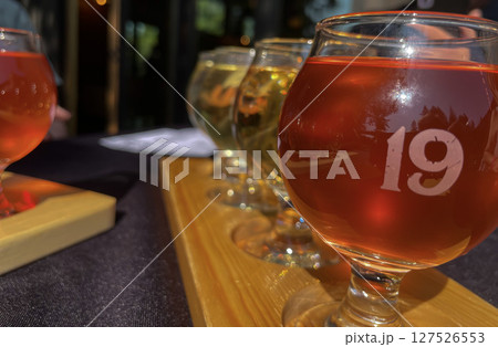 Colorful Craft Cider Flight on Outdoor Patio table 127526553