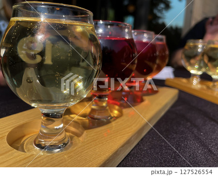 Colorful Craft Cider Flight on Outdoor Patio table 127526554
