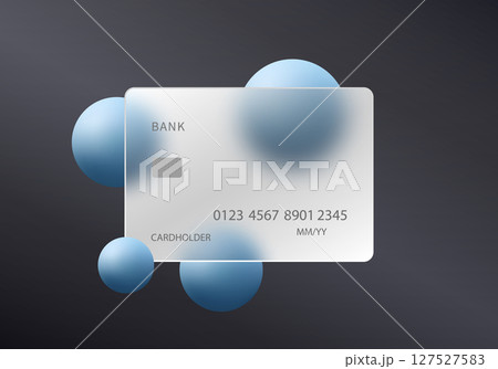Glass credit card with floating blue spheres on dark background 127527583