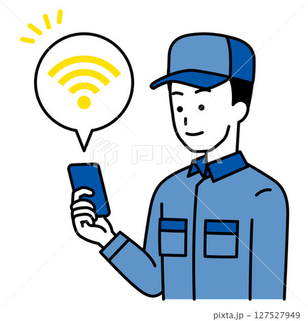 Wi-Fiに繋がっているスマートフォンを持つつなぎ作業服の男性 Wi-Fiに繋がっているスマートフォンを持つつなぎ作業服の男性 127527949