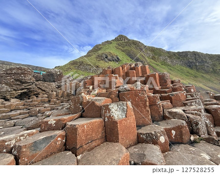 Giant's Causeway is a UNESCO World Heritage Site on Northern Ireland's Antrim Coast, famous for hexagonal stones by volcanic activity and beautiful coast. Giant's Causeway is a UNESCO World Heritage Site on Northern Ireland's Antrim Coast, famous for hexagonal stones by volcanic activity and beautiful coast. 127528255