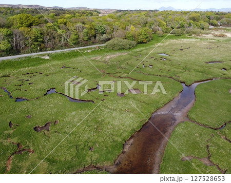 Islay island is located off Scotland west coast featuring wetlands and calm seas. Numerous migratory birds can be observed making it a haven for nature enthusiasts. 127528653