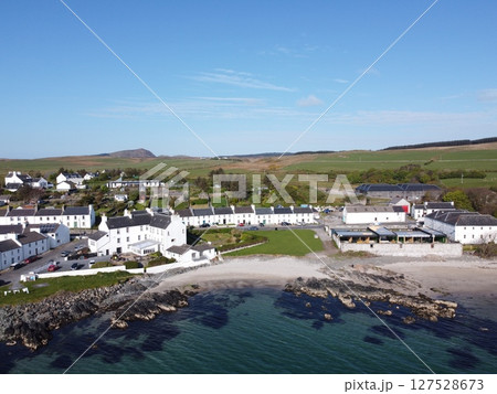Port Charlotte is a town on the west coast of Islay, Scotland. Whisky distilleries and hotels dot the area, with scenic shorelines and historic charm. Port Charlotte is a town on the west coast of Islay, Scotland. Whisky distilleries and hotels dot the area, with scenic shorelines and historic charm. 127528673