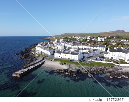 Port Charlotte is a town on the west coast of Islay, Scotland. Whisky distilleries and hotels dot the area, with scenic shorelines and historic charm. 127528674
