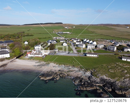 Port Charlotte is a town on the west coast of Islay, Scotland. Whisky distilleries and hotels dot the area, with scenic shorelines and historic charm. Port Charlotte is a town on the west coast of Islay, Scotland. Whisky distilleries and hotels dot the area, with scenic shorelines and historic charm. 127528676