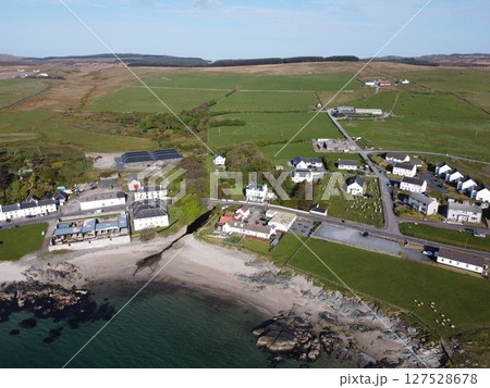 Port Charlotte is a town on the west coast of Islay, Scotland. Whisky distilleries and hotels dot the area, with scenic shorelines and historic charm. 127528678