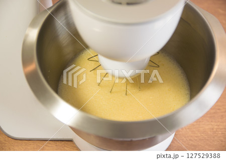 Biscuit metal dough of electric mixer on the kitchen. Biscuit metal dough of electric mixer on the kitchen. 127529388