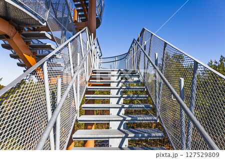 Steel staircase leading to elevated observation tower with mesh railings Steel staircase leading to elevated observation tower with mesh railings 127529809