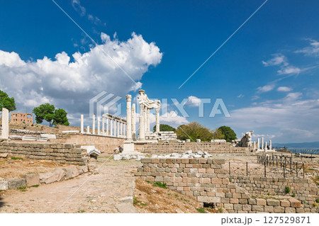Wide view of Temple of Trajan ruins on Pergamon acropolis with standing marble columns and dramatic spring sky in Turkey Wide view of Temple of Trajan ruins on Pergamon acropolis with standing marble columns and dramatic spring sky in Turkey 127529871