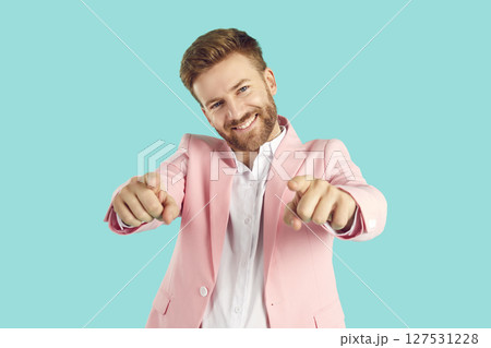 Young handsome man pointing index finger camera on you smiling positive and cheerful 127531228