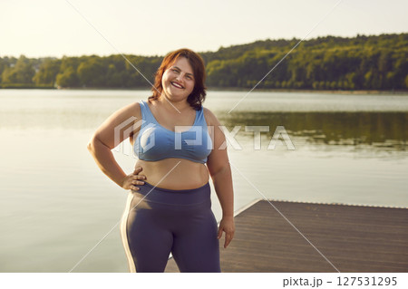 Portrait Of A Smiling Plus Size Woman In Sportswear 127531295