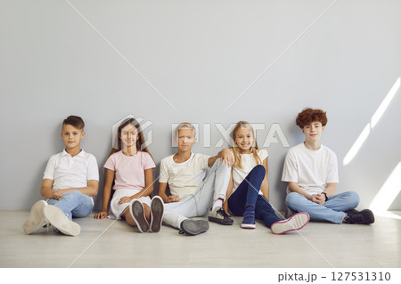 Diverse Group of Children Smiling on Grey Background 127531310