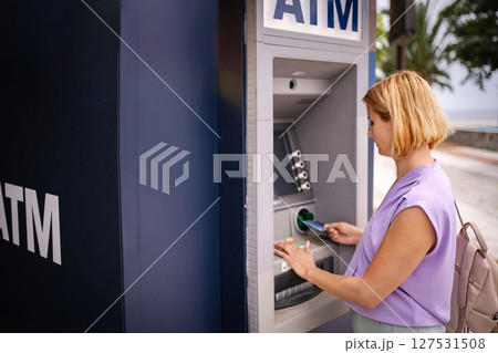 Summer banking at an ATM in beautiful Greece Summer banking at an ATM in beautiful Greece 127531508