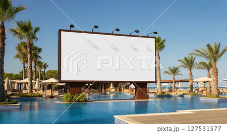 Experience ultimate relaxation by the pool with a stunning beach backdrop and sunny skies 127531577