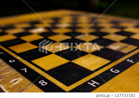 Chessboard during a quiet afternoon in a park inviting strategic battles and thoughtful contemplation 127533382