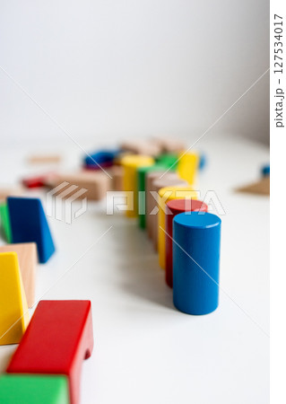 Colorful wooden blocks arranged on white surface 127534017