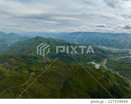 Green forest in the mountains and jungle hills in the highlands. Mindanao, Philippines. Green forest in the mountains and jungle hills in the highlands. Mindanao, Philippines. 127534049