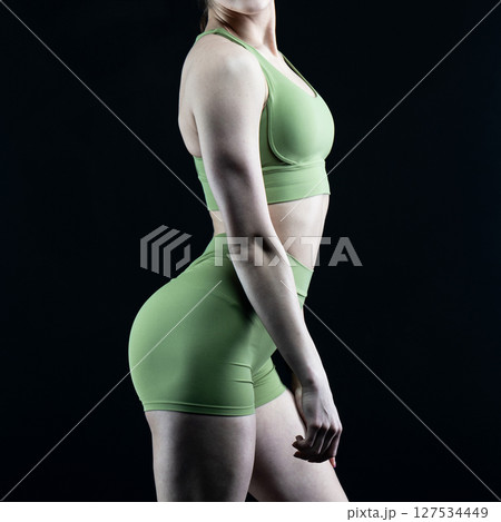 athletic female body on dark background, fitness woman, athletic girl torso athletic female body on dark background, fitness woman, athletic girl torso 127534449