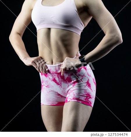 athletic female body on dark background, fitness woman, athletic girl torso athletic female body on dark background, fitness woman, athletic girl torso 127534474