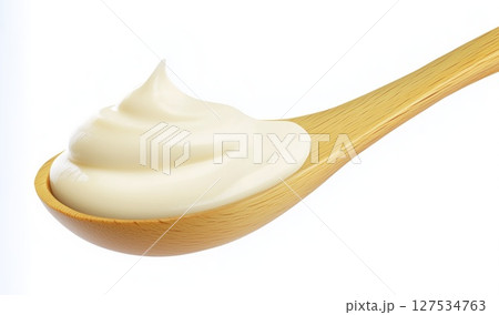 Mayonnaise swirl on wooden spoon isolated on white background with clipping path, copy space Mayonnaise swirl on wooden spoon isolated on white background with clipping path, copy space 127534763