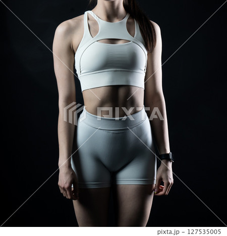 athletic female body on dark background, fitness woman, athletic girl torso athletic female body on dark background, fitness woman, athletic girl torso 127535005