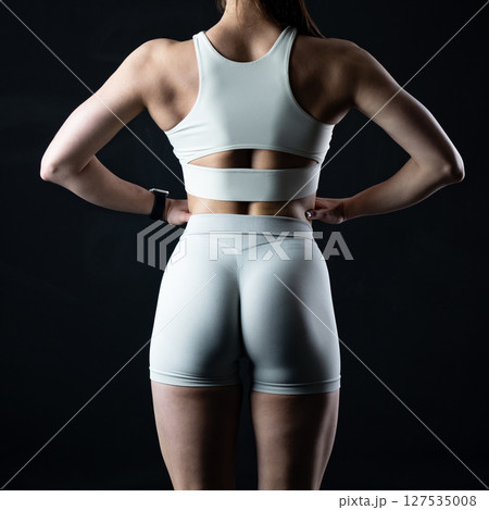 athletic female body on dark background, fitness woman, athletic girl torso athletic female body on dark background, fitness woman, athletic girl torso 127535008