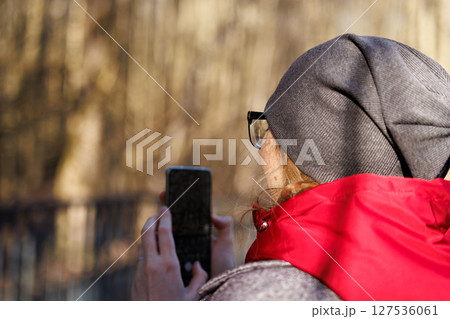 Capturing moments of serenity while exploring nature trails in autumn sunlight 127536061