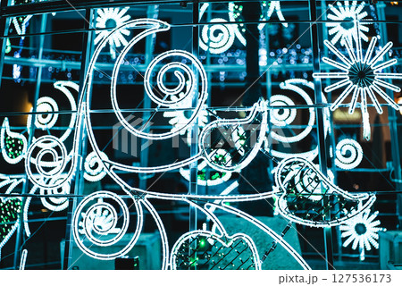 creative illuminated christmas decorations with led and neon light figures and shapes, new year eve banner background creative illuminated christmas decorations with led and neon light figures and shapes, new year eve banner background 127536173