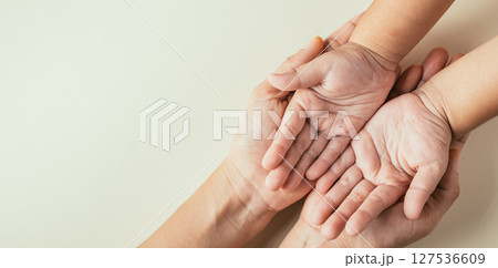 Family Day concept, Top view of parents and kid holding empty hands isolated. Signifying togetherness support and the legacy passed through generations. 127536609