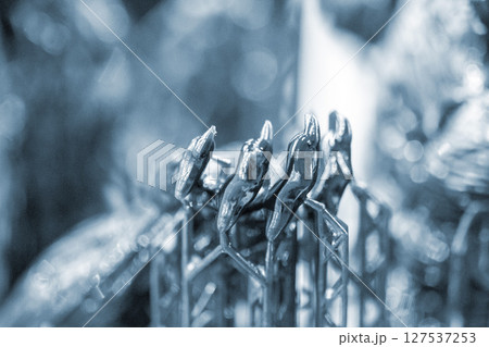 An object printed on a 3D printer from hardened rubber close-up. Model black color created on a 3D printer from hardened rubber under influence of ultraviolet light. SLA 3D printing. Stereolithography 127537253