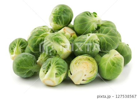 Fresh green Brussels sprouts piled on a white background. 127538567