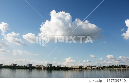 Panoramic view of the left bank of the Dnieper River. Dnieper. Ukraine. Reflection of the sky with clouds on the water surface. 127539740