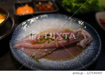 raw squid carcass for frying Thai seafood dish with squid, chili, and herbs in sweet-spicy sauce. 127540497