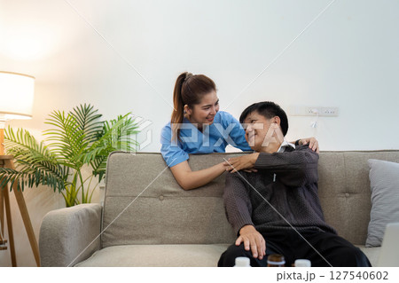 elderly touch hand on back of hand caregiver or nurses to express thankful elderly touch hand on back of hand caregiver or nurses to express thankful 127540602